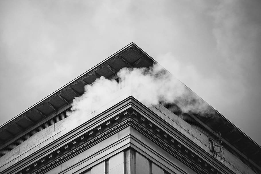 building, smoke, sky, architecture, black and white, cloud - sky, low angle view, building exterior, built structure, nature