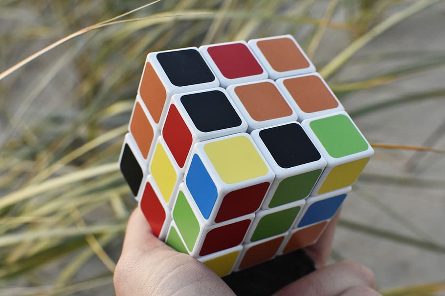rubik cube, hand, outside, puzzle, game, colors, concentration, cube, solving, toy