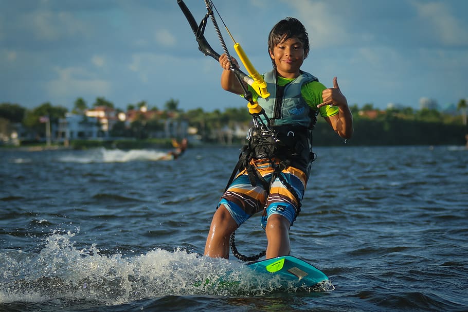 kitesurfing, kite boarding, beach, ocean, kid, boy, water, real people, leisure activity, lifestyles
