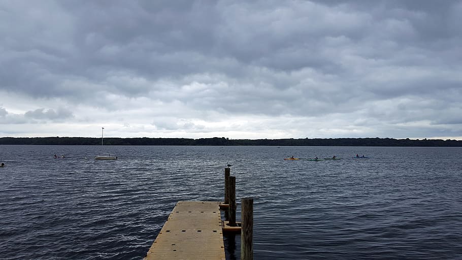 kayaers paddling, waters, manasquan reservoir, stormy, skies., man made lake, artificial lake, trees stumps, water, lake