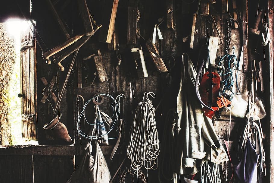 workshop, shed, tools, wood, rope, string, coat, saw, hanging, large group of objects