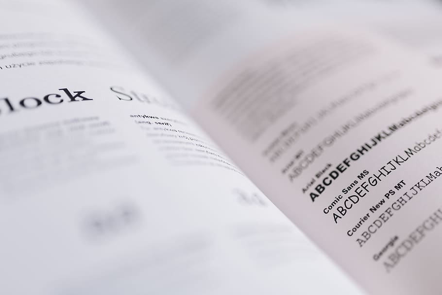 typography book, letters, typo, typography, comic sans, paper, finance, business, selective focus, close-up
