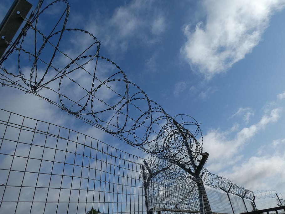 fence, wire, barbed wire, security, boundary, cloud - sky, sky, day, low angle view, barrier