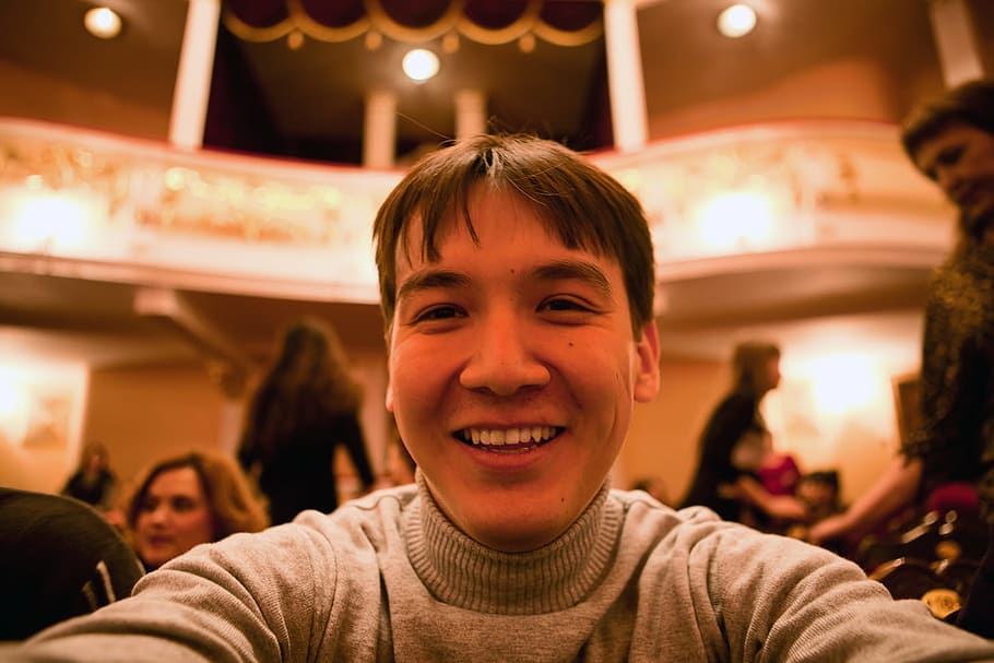 man, opera, seat, theater, young, smile, yellow, portrait, smiling, looking at camera