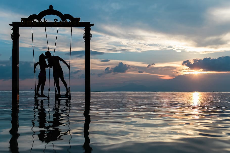 couple, kissing, love, romance, swing, ocean, sea, sunset, dusk, silhouette
