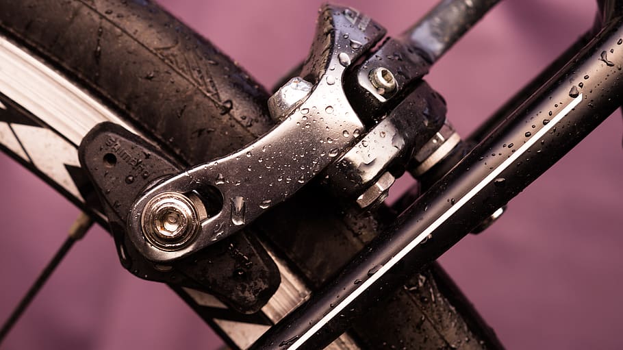 bicycle, brake, rear, cycling, wheel, metal, close-up, indoors, focus on foreground, selective focus