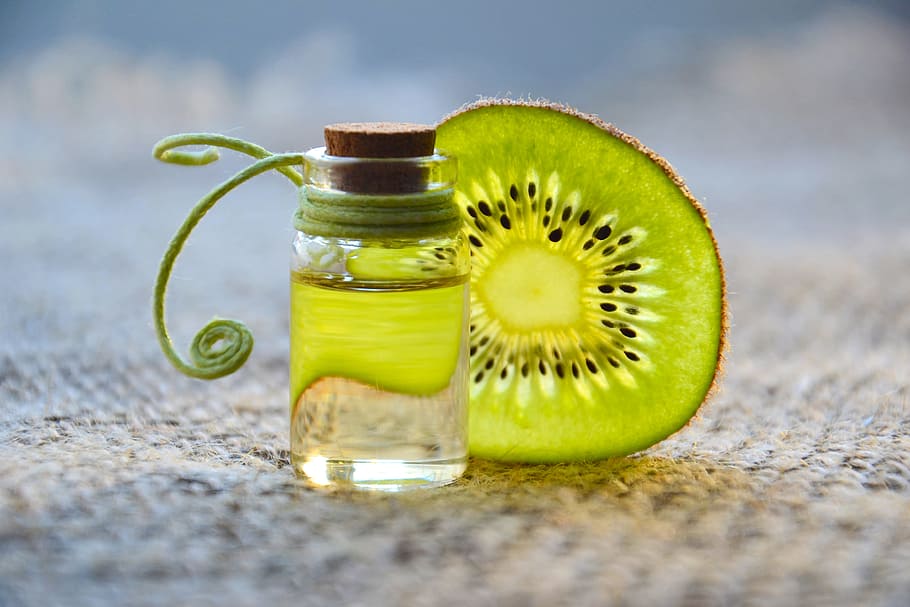 cosmetic oil, essential oil, beauty, spa, kiwi, glass bottle, aromatherapy, cosmetology, natural cosmetics, medicine