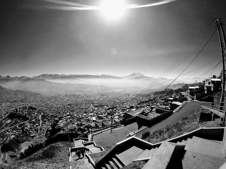 la paz, bolivia, mountain, sky, architecture, built structure, building exterior, city, sunlight, cityscape