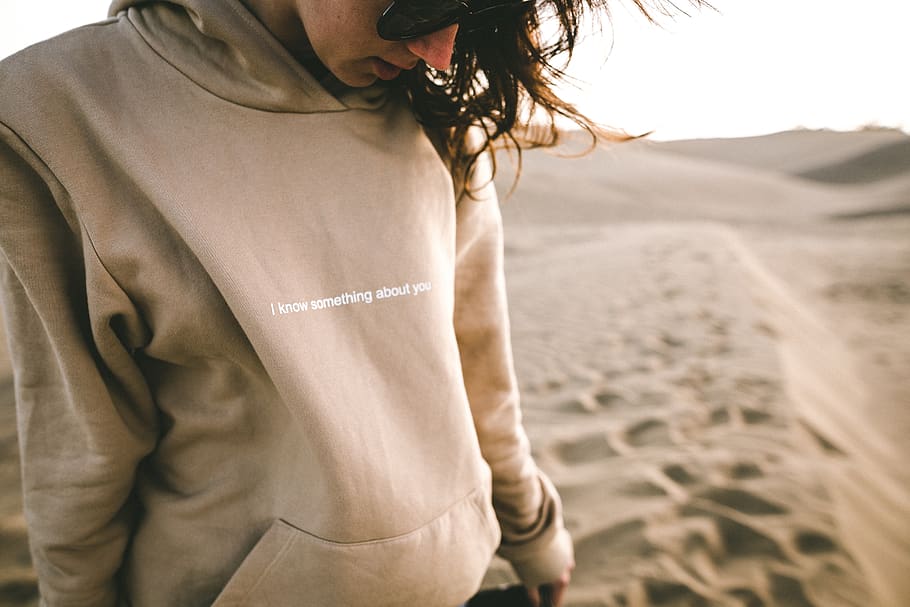 people, statement jacket, hoodie, sand, desert, shades, sunglasses, one person, adult, midsection