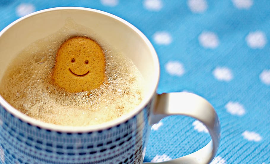 coffee, mug, gingerbread man, woman, smile, happy, frothy, pattern, blue, spots background