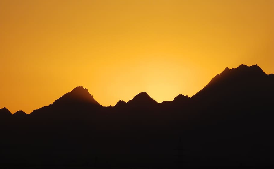 mountains, west, the sun, twilight, orange, shadows, the outline of the, silhouette, mountain, beauty in nature