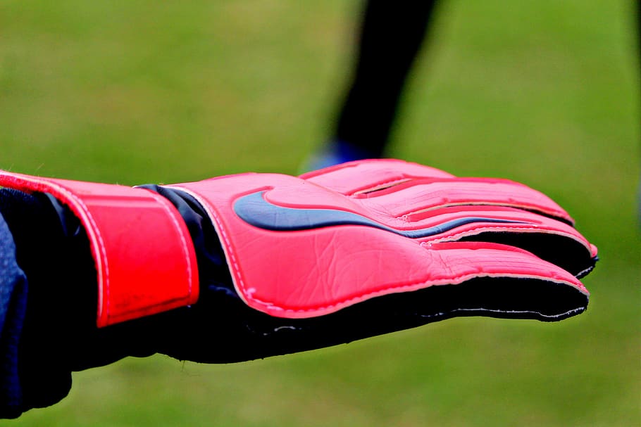 goalkeeper gloves, goalkeeper, gloves, football, football gear, nike, sport, red, focus on foreground, one person