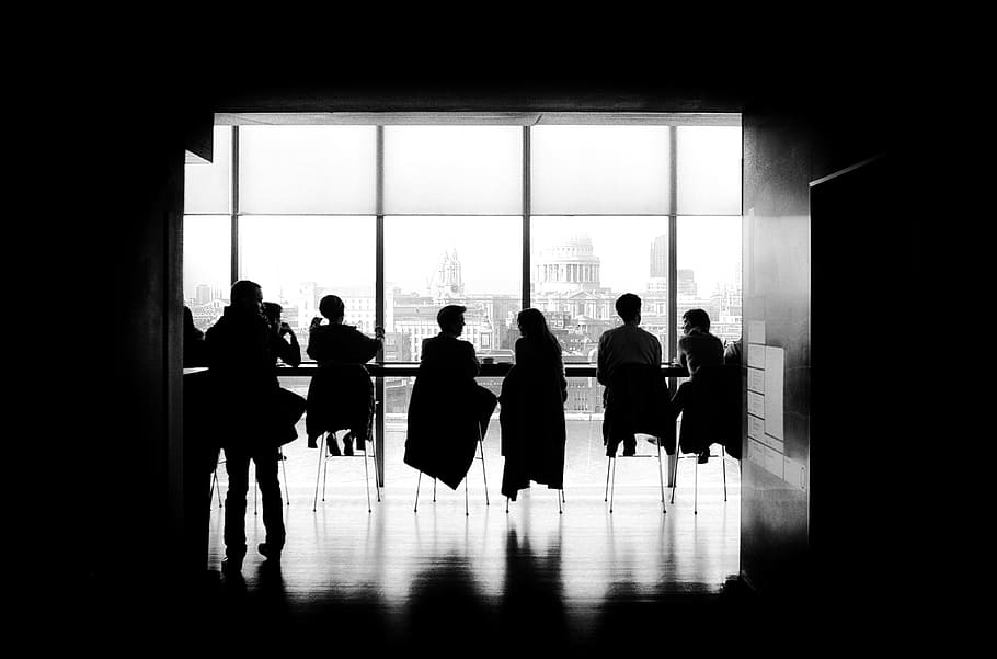 people, men, girls, sitting, talking, high chairs, business, black and white, building, silhouette