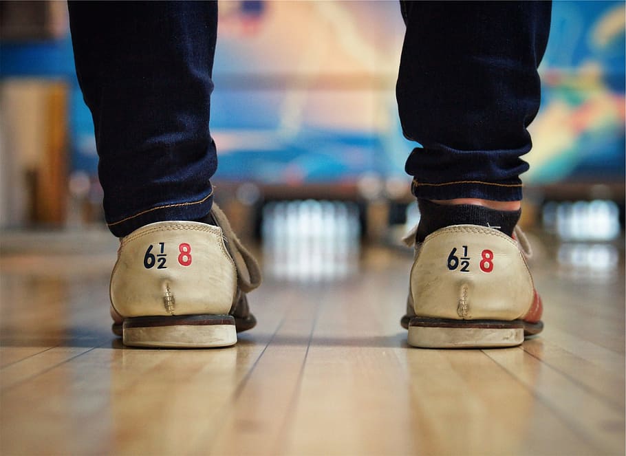 bowling alley, shoes, lane, pins, human body part, low section, body part, human leg, indoors, shoe