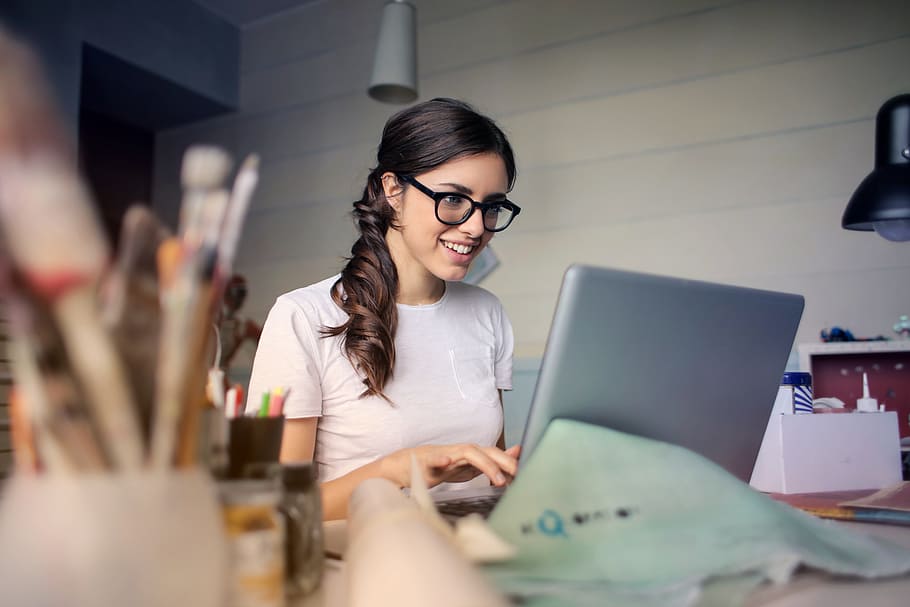 woman, work, laptop, computer, desk, office, smile, glasses, art, paint