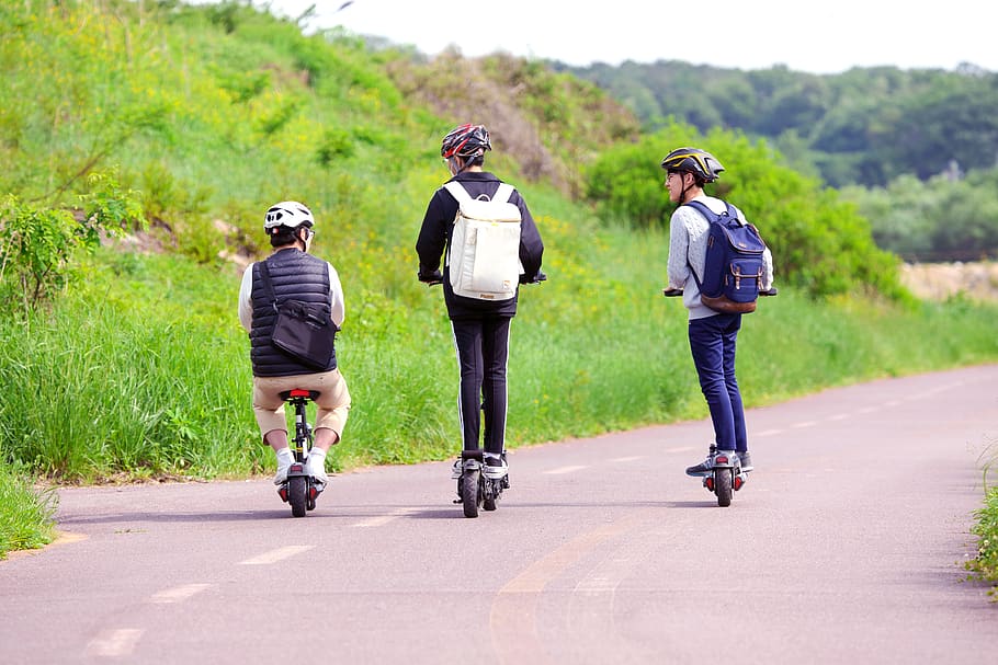 three people, teenager, fun, electric bike, road, board, full length, rear view, transportation, men