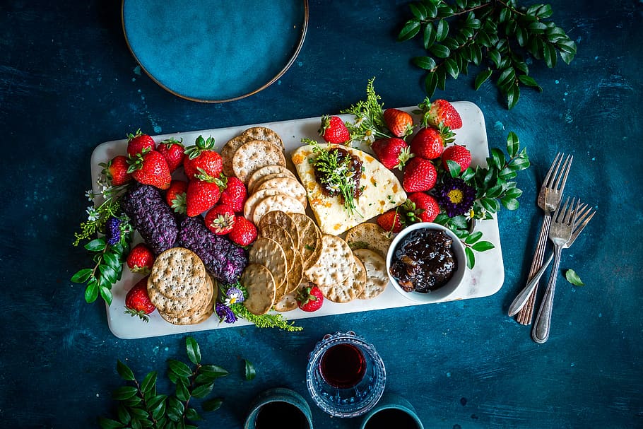 strawberries, biscuit, crackers, tea, drink, wine, foods, table, food and drink, food