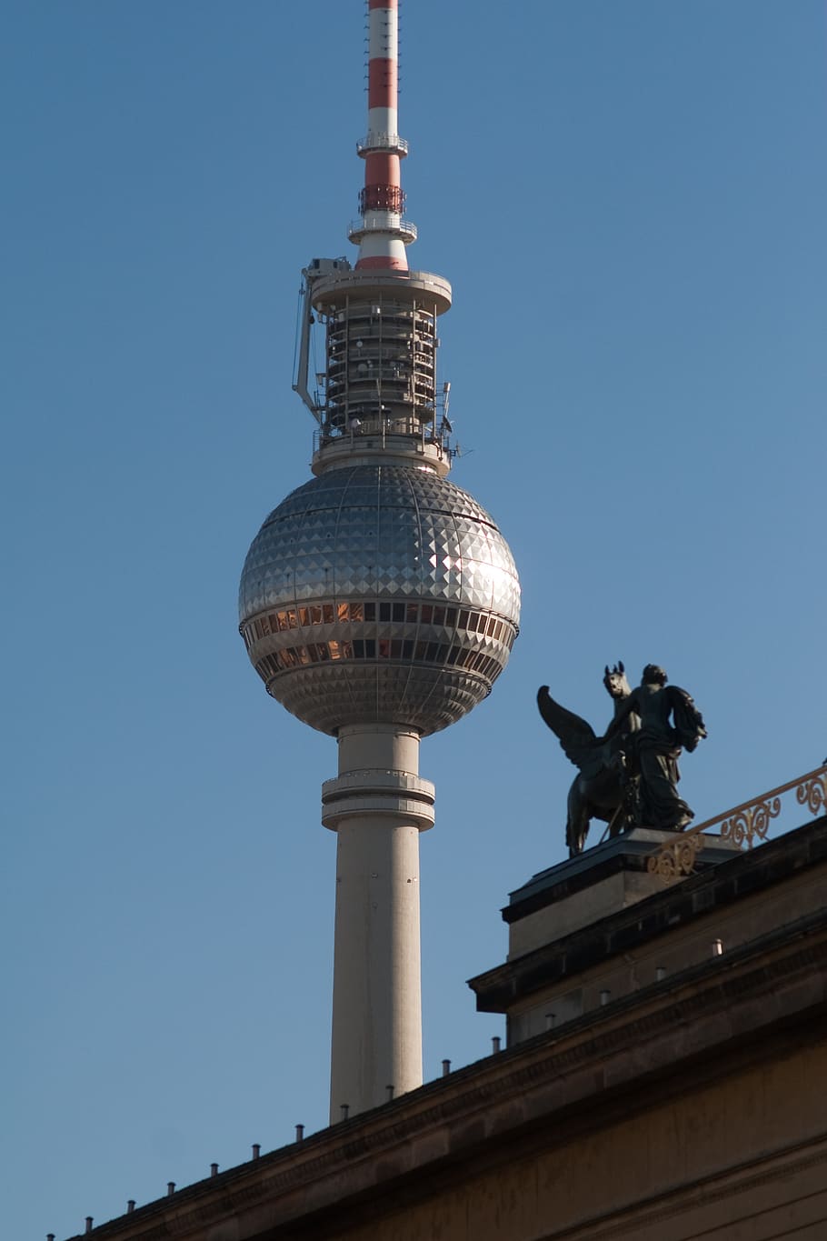 hotels in berlin, germany, tv tower, nearby, statue, architecture, built structure, sky, building exterior, low angle view