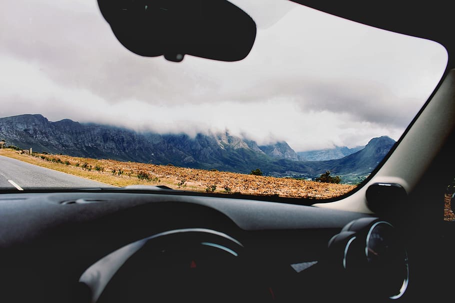 car, vehicle, travel, transportation, steering wheel, nature, mountain, adventure, fog, clouds