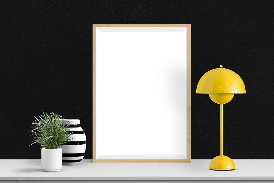 poster, frame, lamp, plants, plant, yellow, white color, table, indoors, potted plant