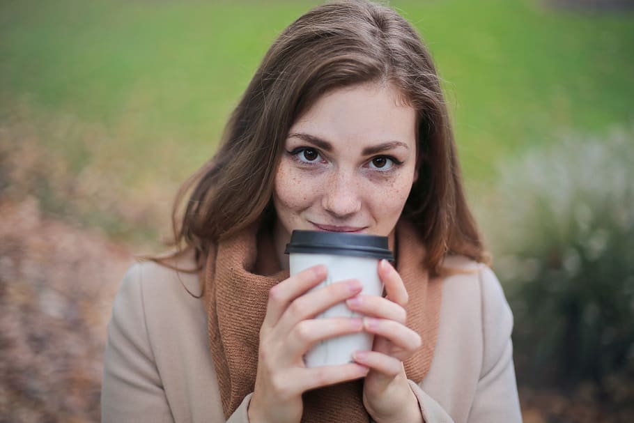 woman, camel jacket, scarf, holding, white, black, disposable, coffee cup, autumn park, 25- 30 years