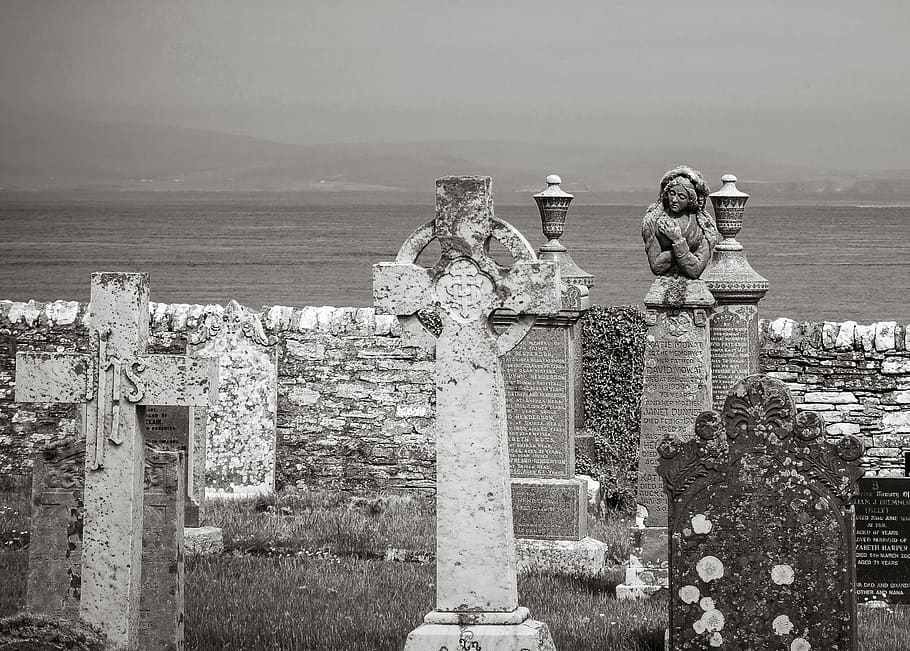 boy, cemetery, grave stones, sea, black and white, scotland, caithness, death, wall, water