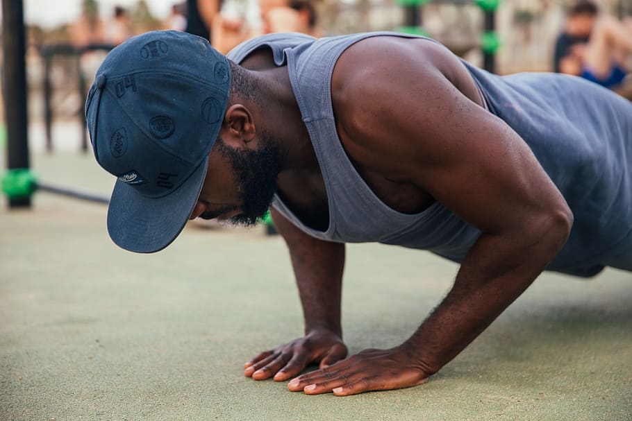 young, african man, wearing, cap, push-up exercise, 25-30 year old, Adult, African, Fit, Floor