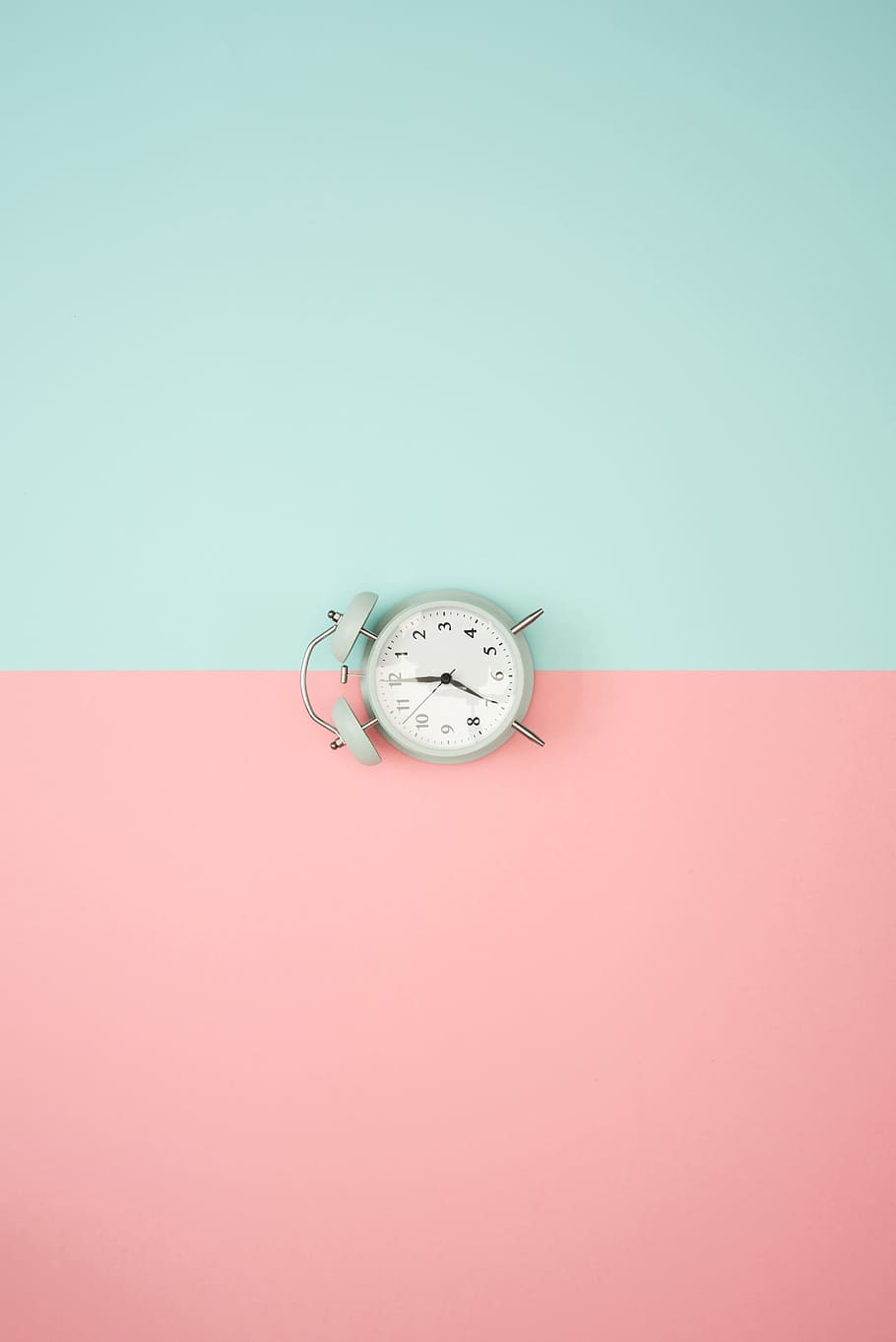 clock, pastel background, blue, pink, time, alarm, colorful, colored background, studio shot, indoors