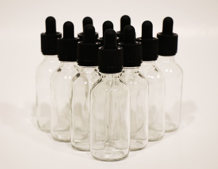 clear glass, dropper, bottles, studio shot, indoors, close-up, still life, white background, in a row, bottle