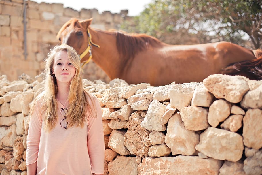 teenage, blonde, girl, wearing, peach dress, standing, outside, horse ranch, animal, face