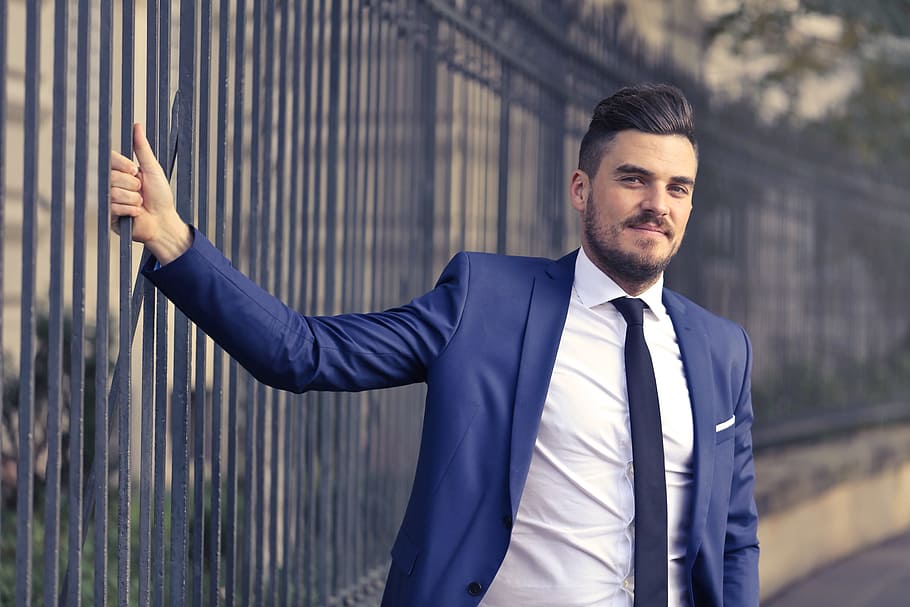 bearded, caucasian man, formal, suit, white, shirt, standing, metal railings, 30-35 year old, Blue