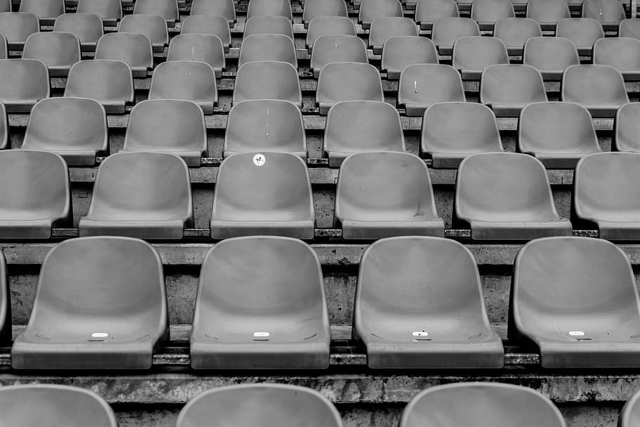 seats, chairs, stadium, rows, event, black and white, in a row, seat, chair, large group of objects