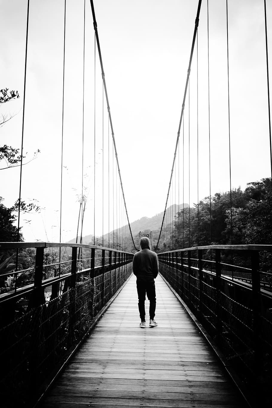 man, walking, bridge, black and white, people, travel, adventure, river, hoodie, jeans