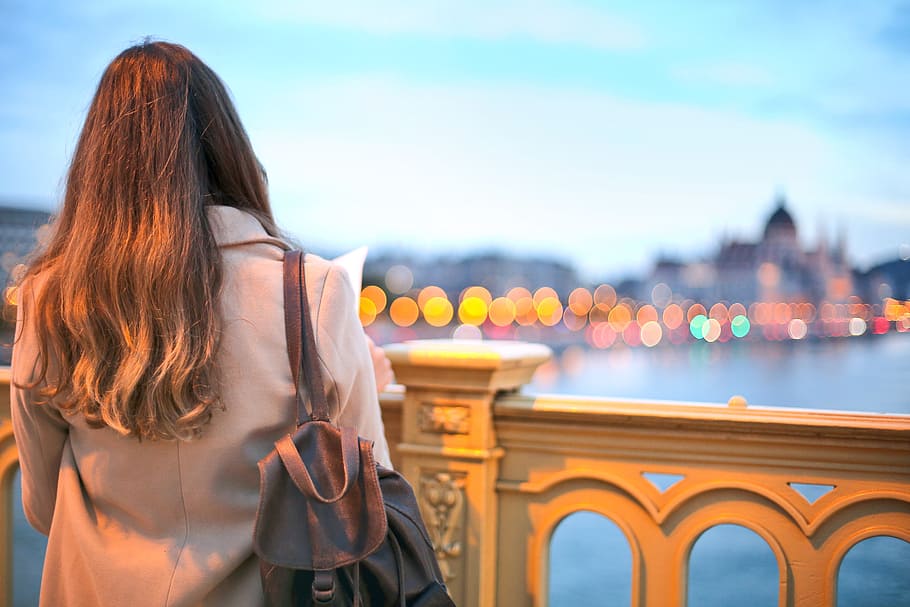 view, behind, young, woman, trench coat, black, leather backpack, looking, danube river, back