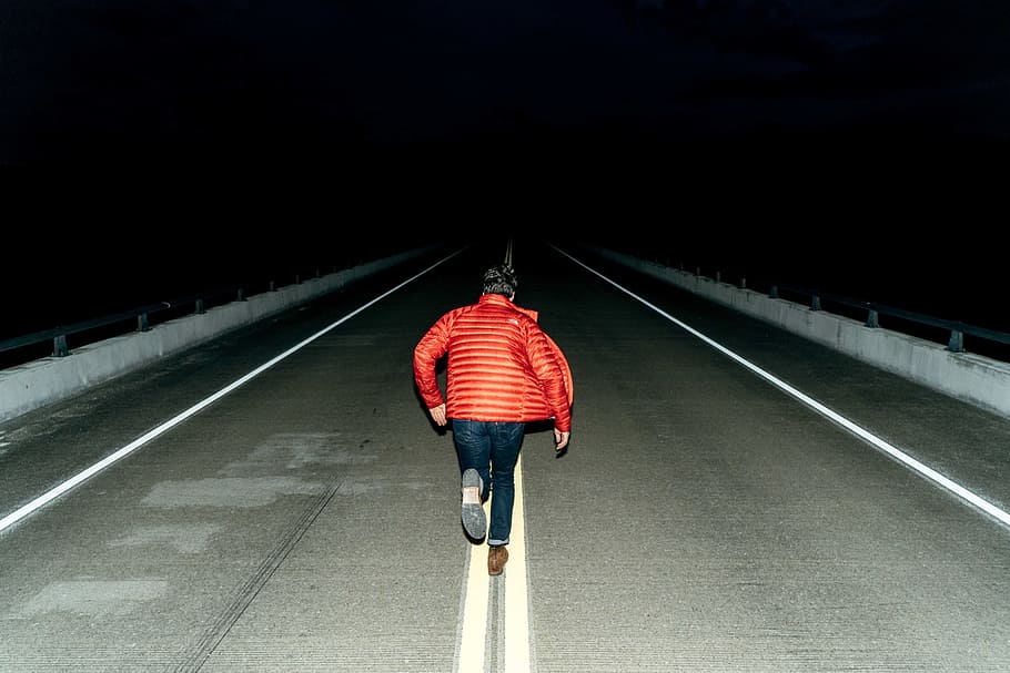 people, man, running, orange, jacket, road, street, empty, dark, night