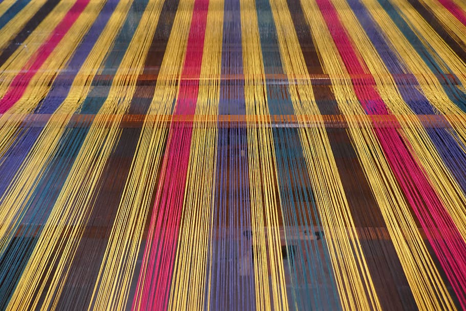 weaving mill, weft threads, loom, full frame, pattern, backgrounds, multi colored, indoors, striped, yellow