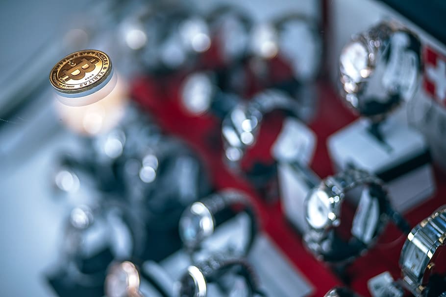 shining, gold-plated, physical, bitcoin, glass shelf, inside, luxury watches shop, business, retail, large group of objects