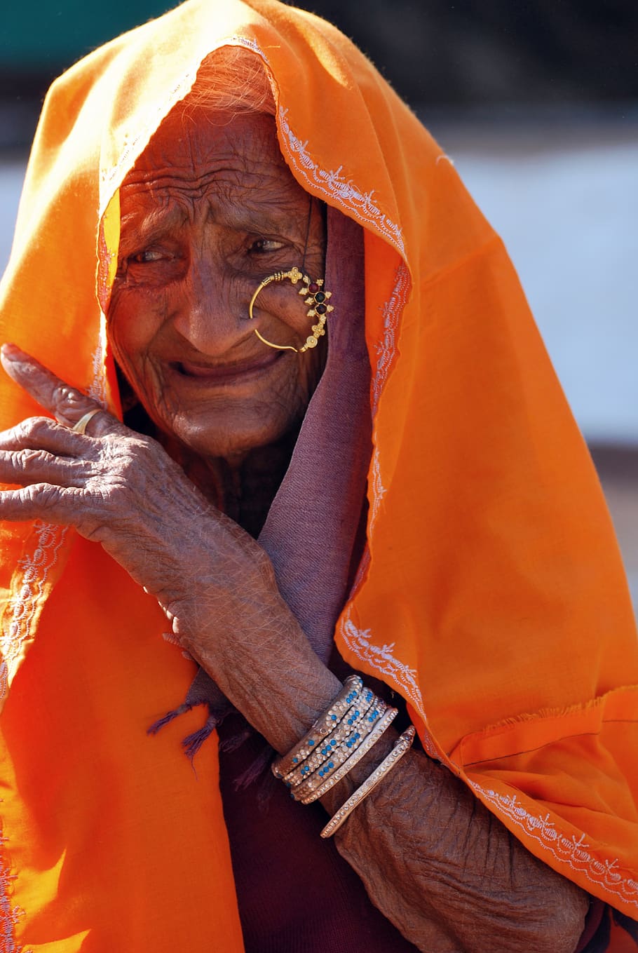 old lady, ethnic, wrinkles, jewelry, cultural, weather worn, orange, real people, one person, traditional clothing